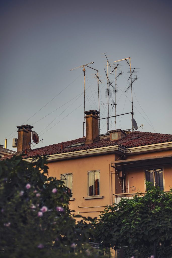 a-building-with-a-lot-of-antennas-on-top-of-it-uk7ust8tx1a a-building-with-a-lot-of-antennas-on-top-of-it-uk7ust8tx1a